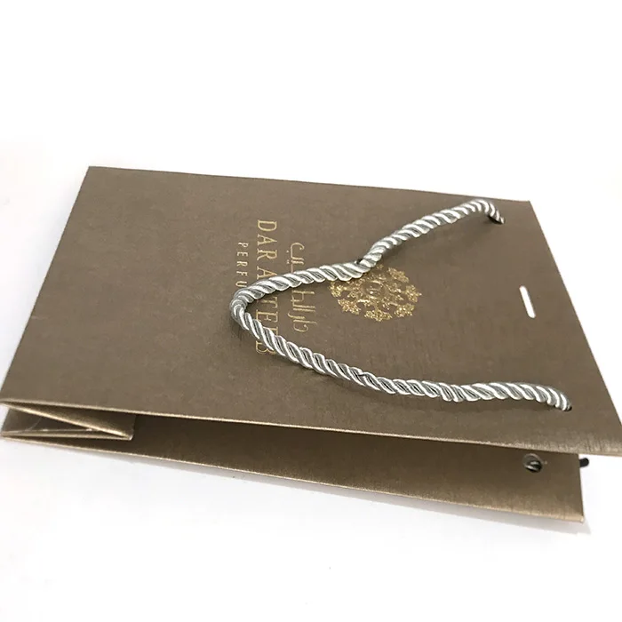 Custom logo printed cheap christmas fancy cosmetic paper shopping jewelry packaging gift bag with rope Twisted handle wholesale