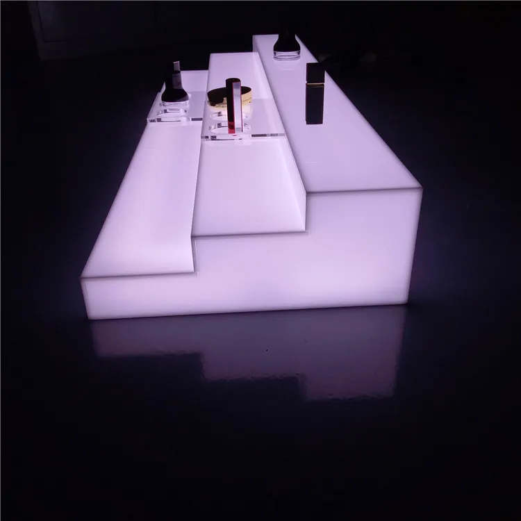 
illuminated led light acrylic display riser stand for cosmetic, lipstick, lip gloss, eyeliner,eyelash, perfume, nail polish 