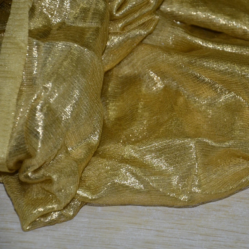 
silk gossamer golden shiny silk tulle fabric with foil 