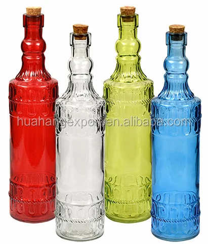 Colored patterned glass bottle with cork lid