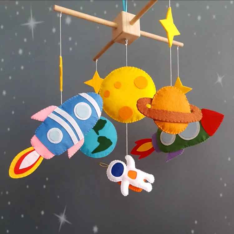 DIY felt hanging crib decoration with rocket and spaceman shape