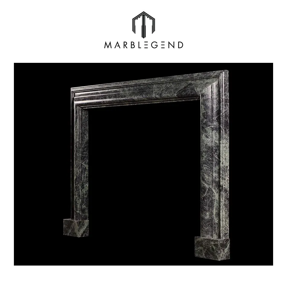 
a queen anne style bolection dark green marble fireplace 