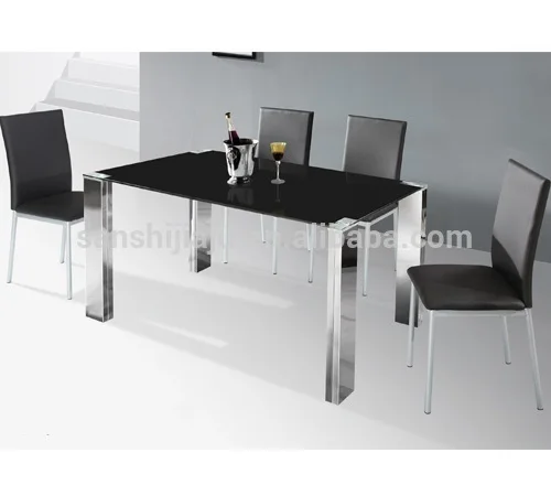 
Tempered glass dining table with stainless steel stand for sale 