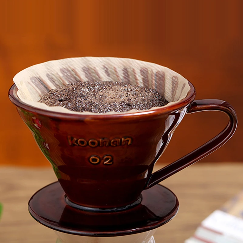 
Ceramic filter cup dripping coffee into coffee dripper reusable filter coffee dripper 