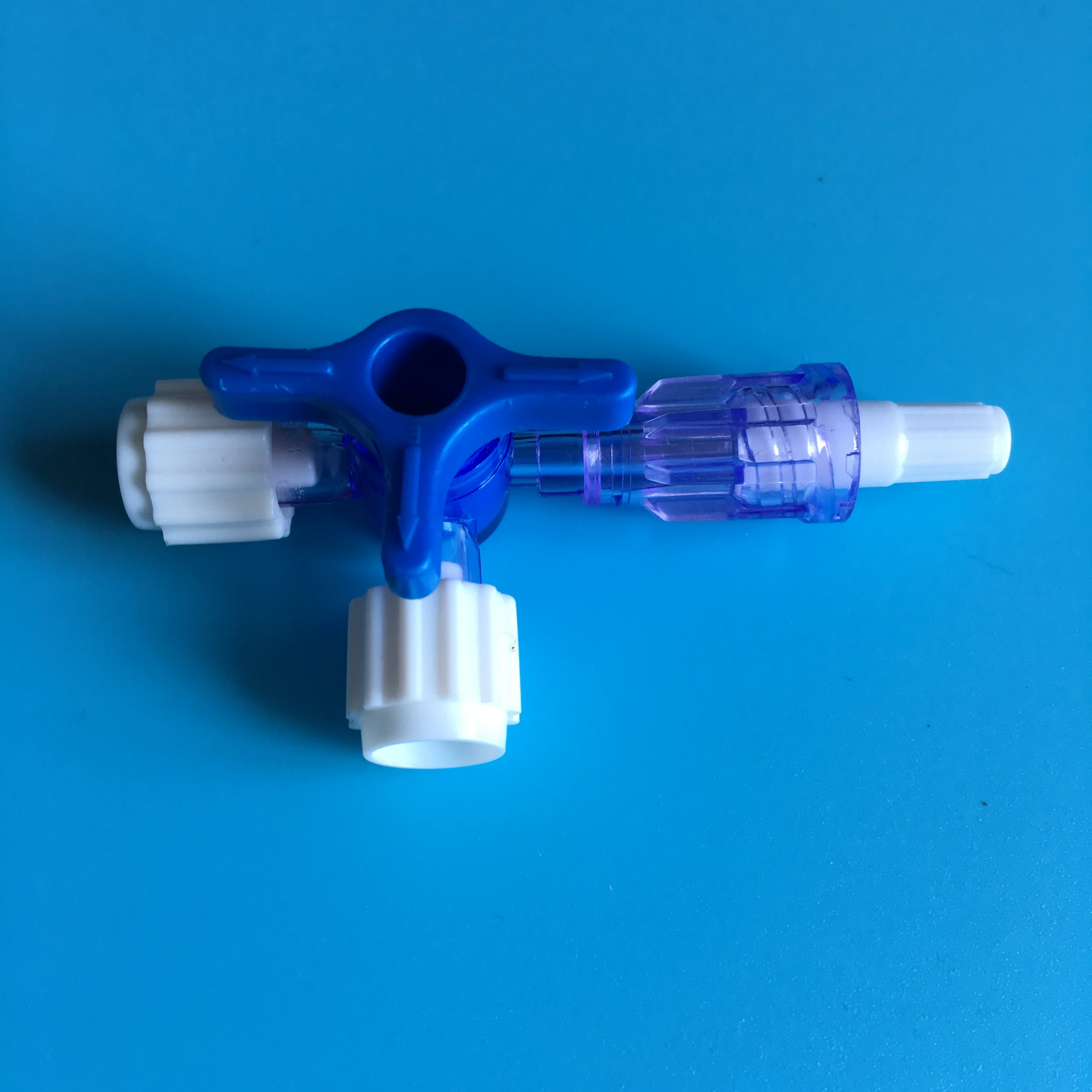 Three way stopcock with two female luer lock one male luer lock