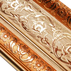 Polystyrene extruded interior mouldings with inserts