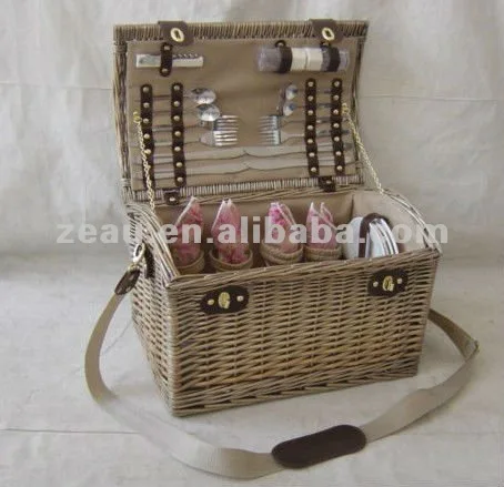 
wicker picnic basket with tableware 