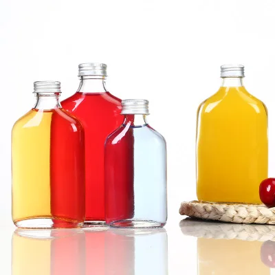 Free Sample Manufacturer New Design Green Glass Flask Bottles for Juice Wine Milk Oil Sauce Soda Aromatherapy