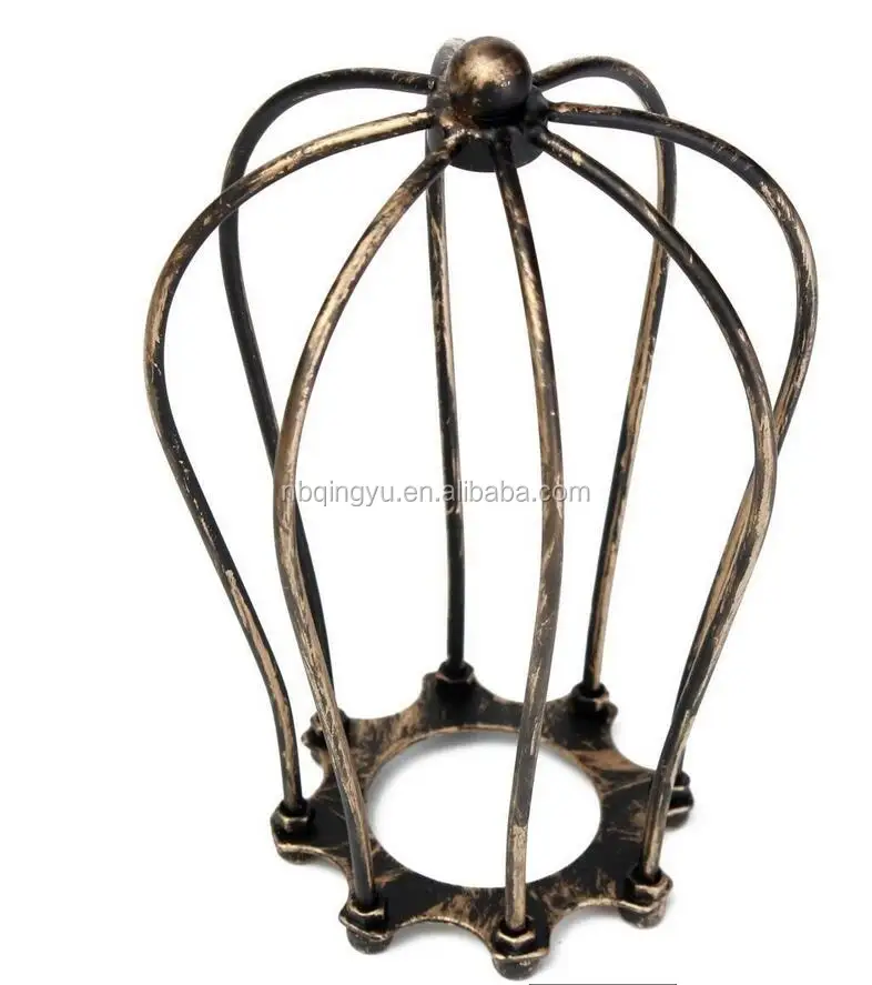 Industrial style metal cage beside lamp cast iron lampshade