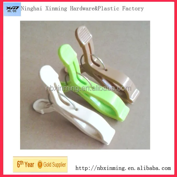 Round plastic clothes peg with hook