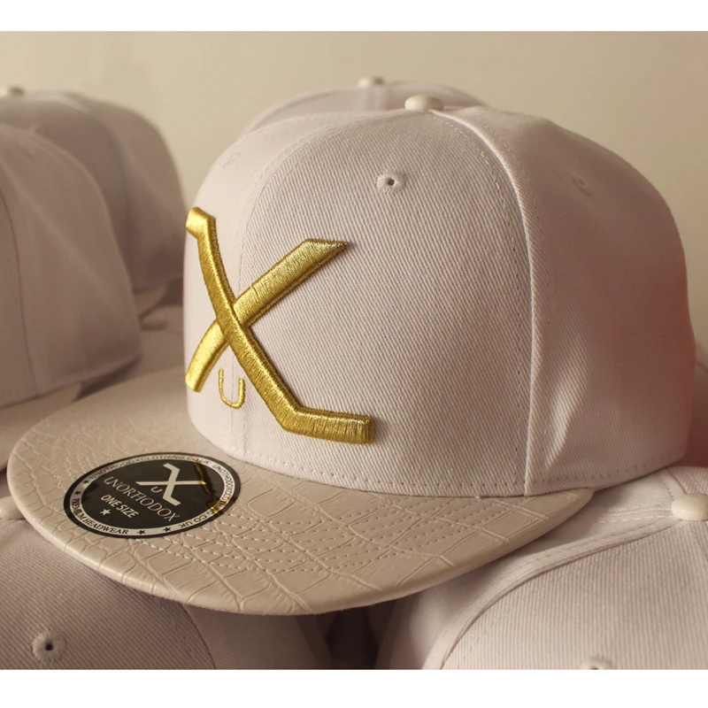 Acrylic leather brim snapback cap with gold metallic thread embroidery