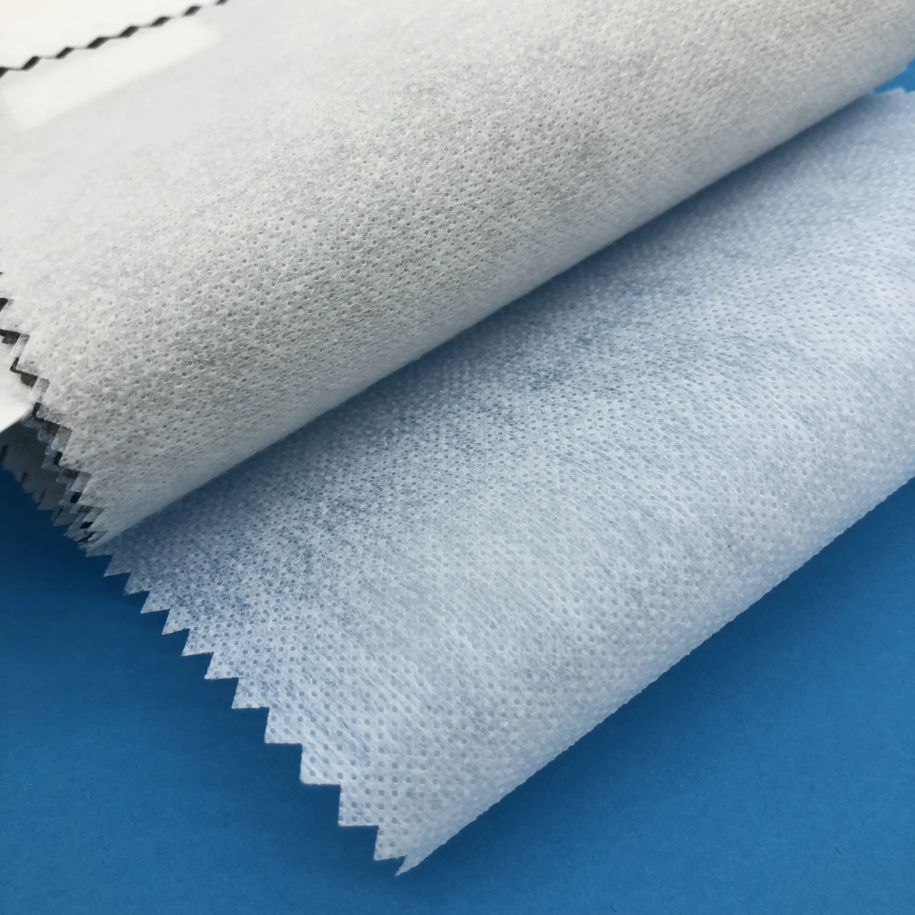 
100 polyester nonwoven fusible hot rolling interlining for apparel 