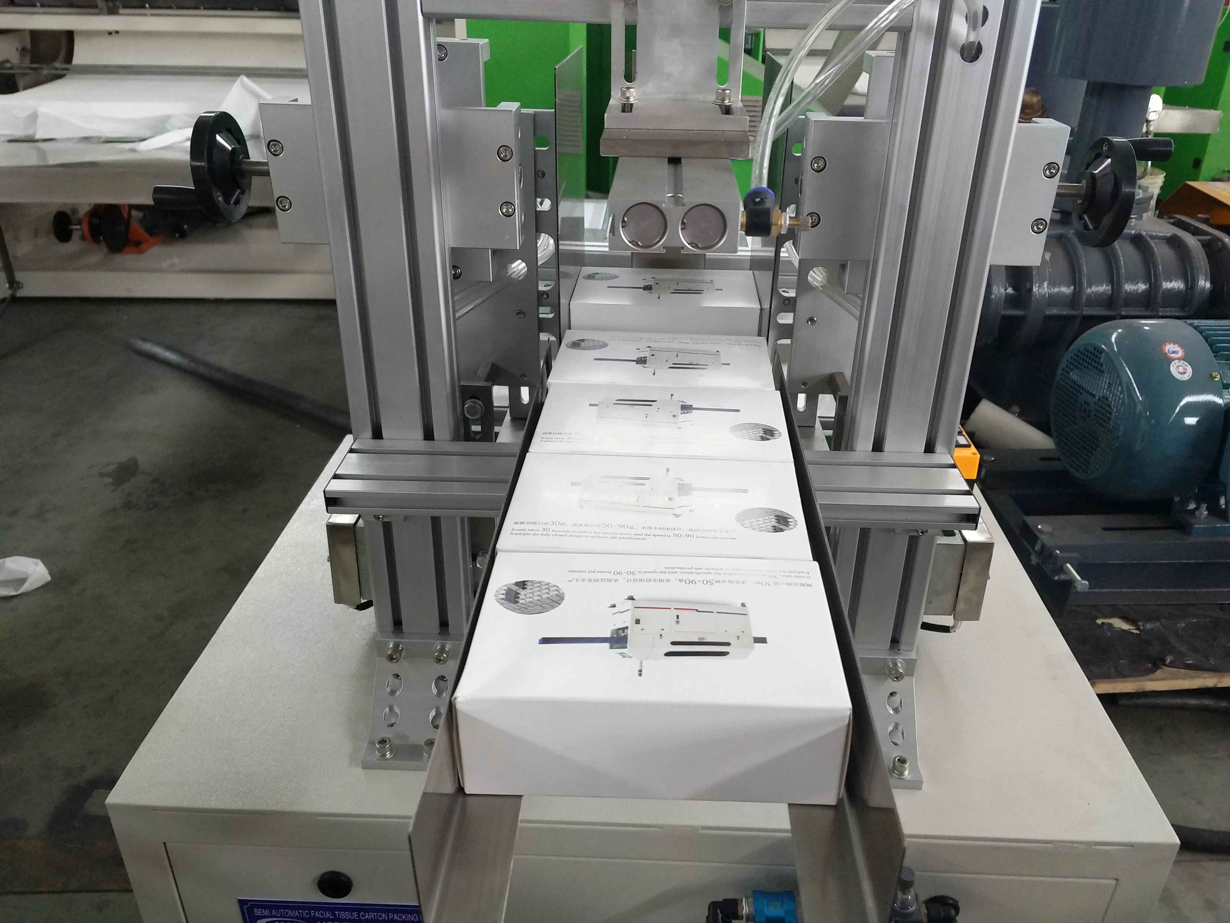 New design mechanical facial tissue box sealing and packing machine