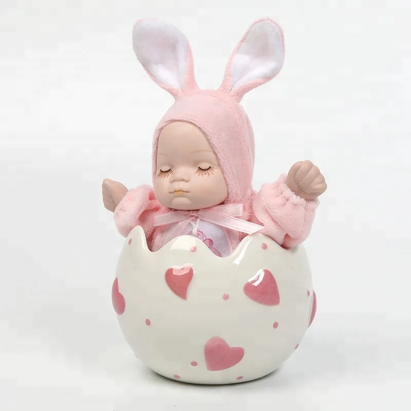 Portable hand-made shake head porcelain doll music box