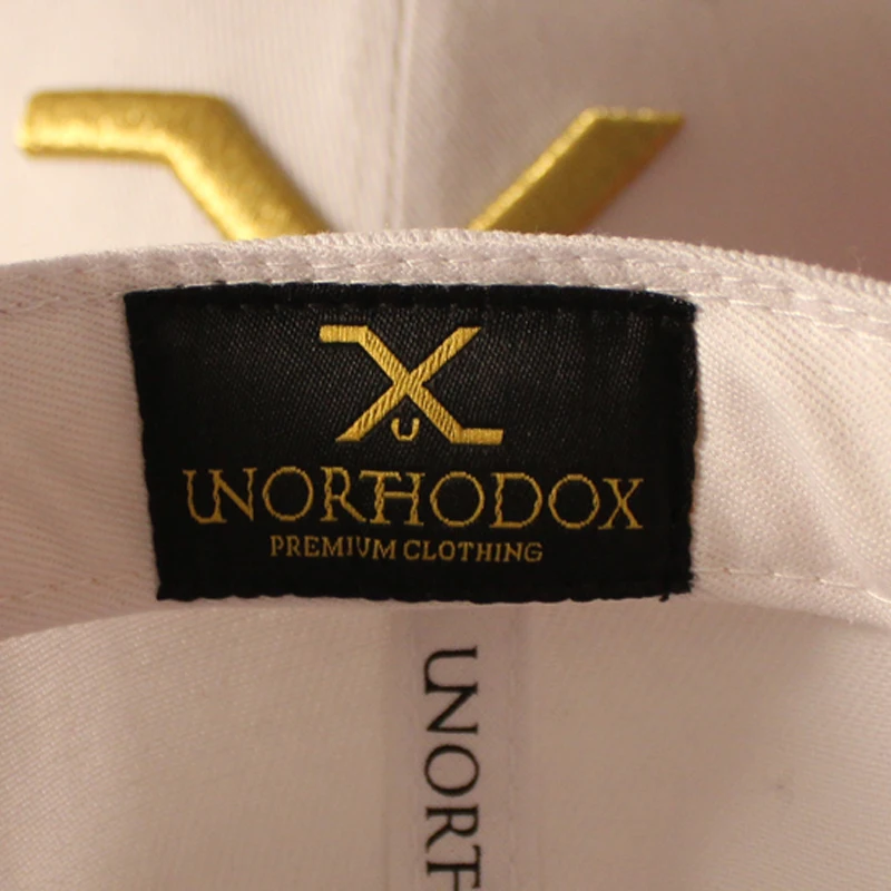 Acrylic leather brim snapback cap with gold metallic thread embroidery