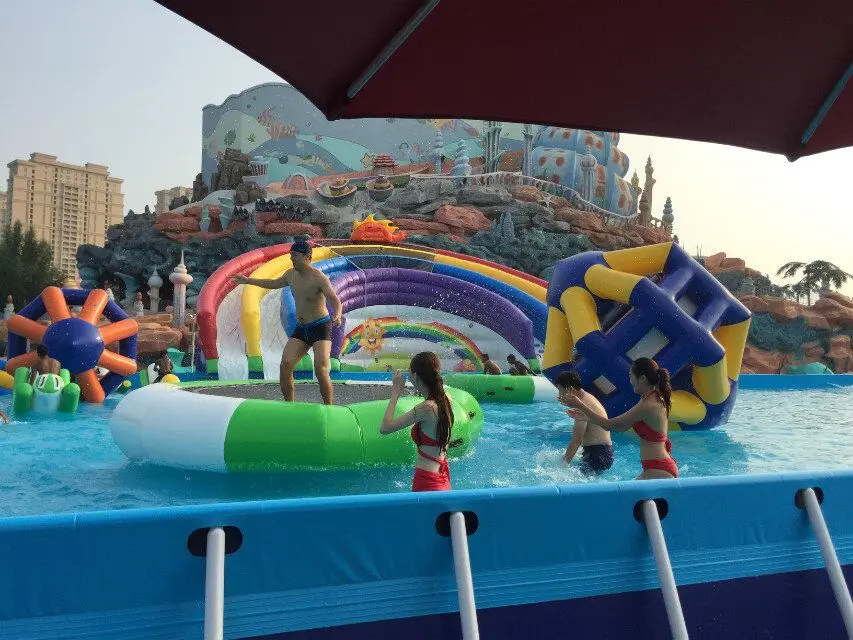 Guangzhou wholesale cheap price large inflatable water slide with steel frame swimming pool inflatable water park equipment 2018
