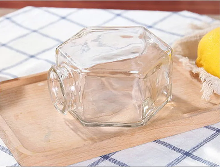 Оптовая продажа 100 мл шестигранная пустая Роскошная стеклянная банка для хранения меда с деревянной крышкой