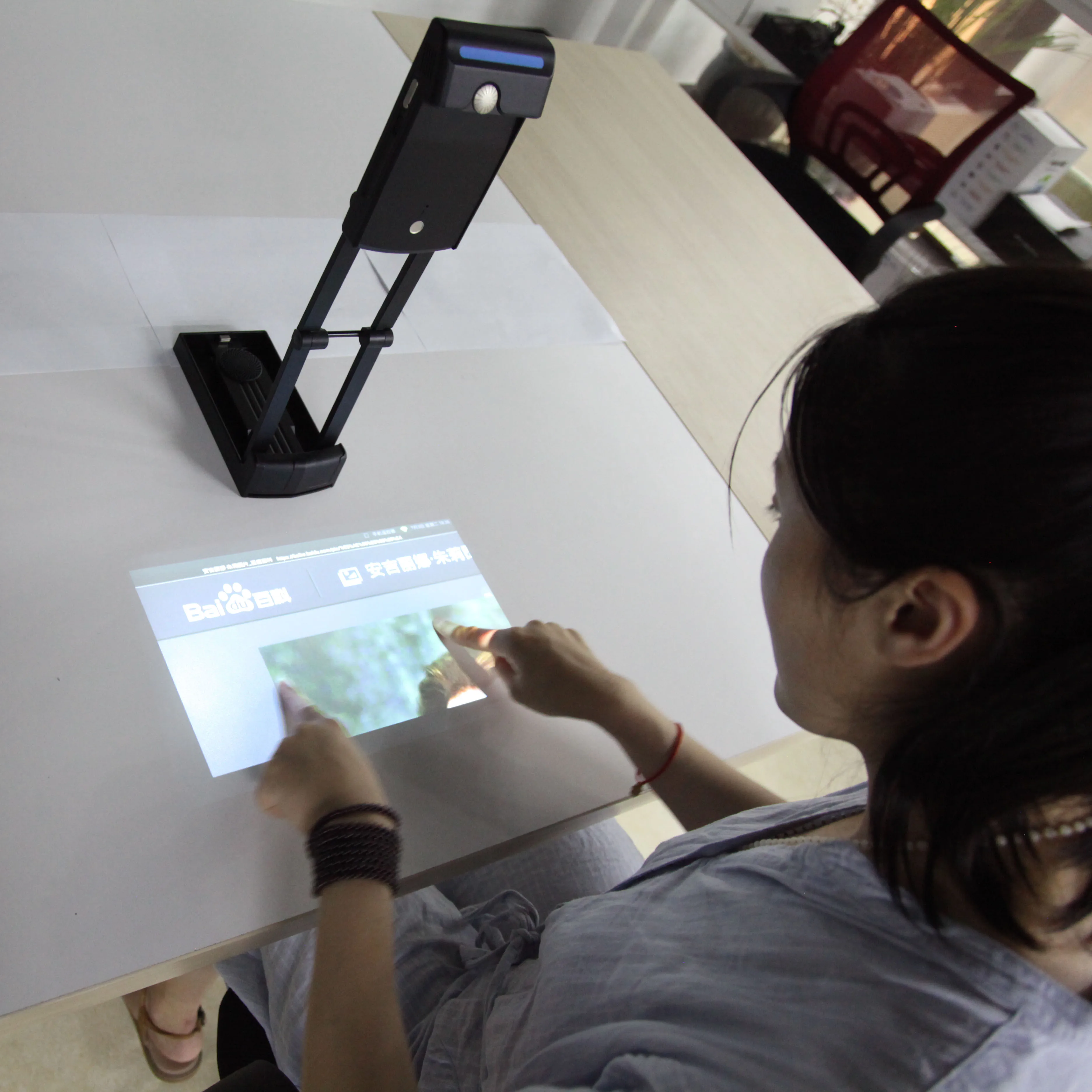 Portable interactive wifi multimedia projector,  laser image calibration technology