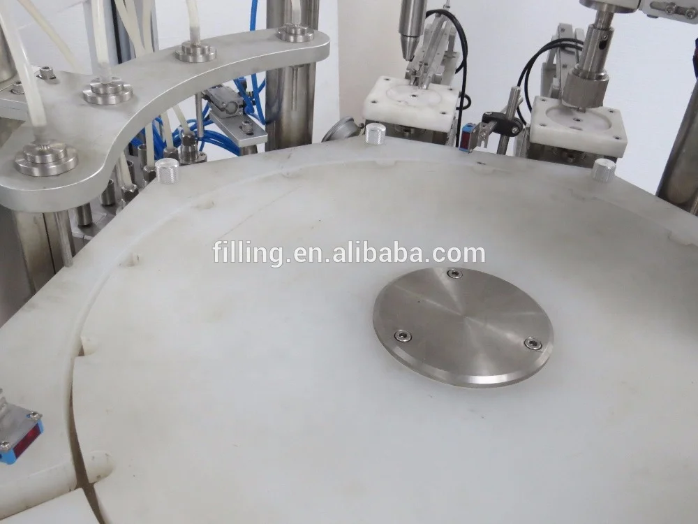 Mechanical hand style double-head filling and capping machine DTNX-60Y type