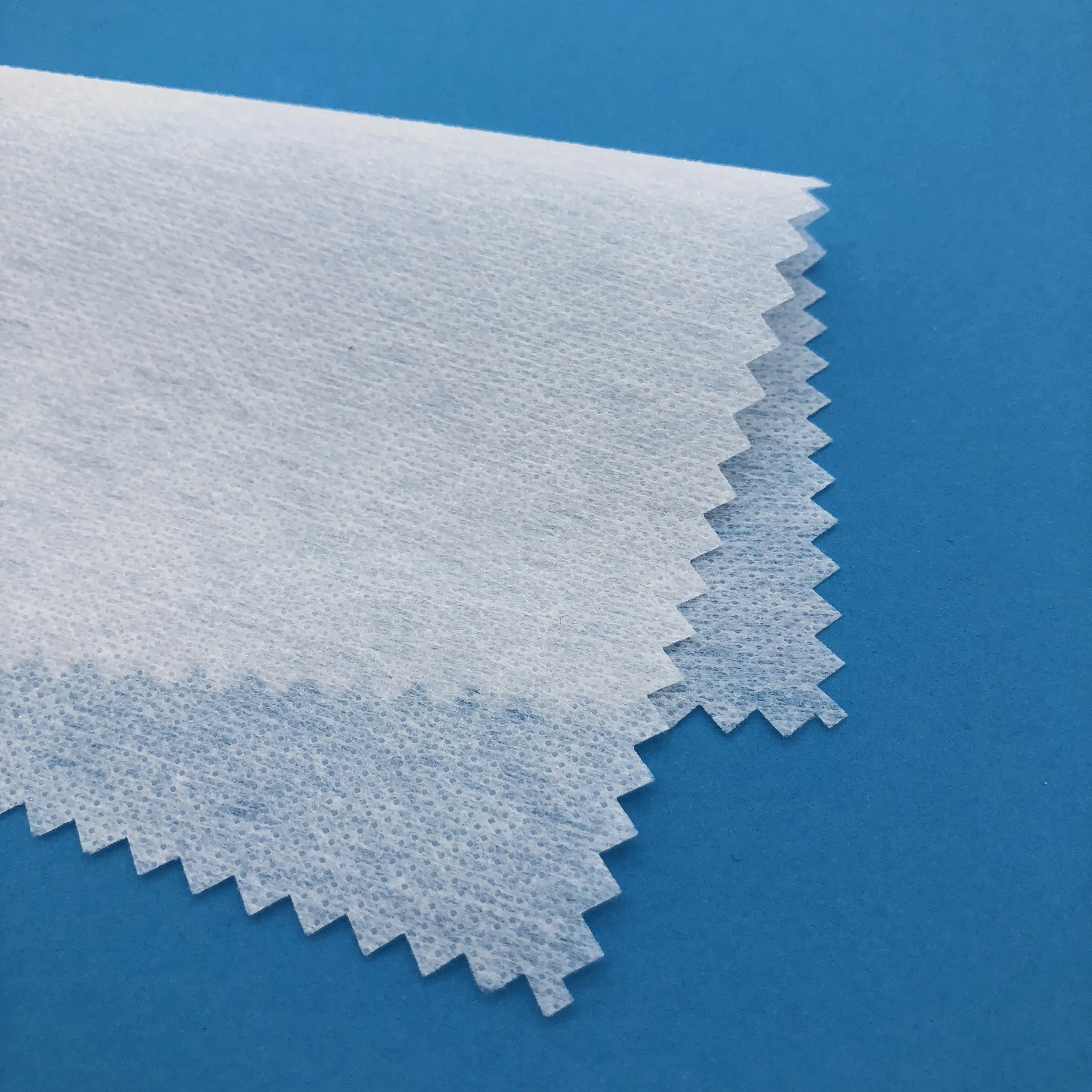 
100 polyester nonwoven fusible hot rolling interlining for apparel 