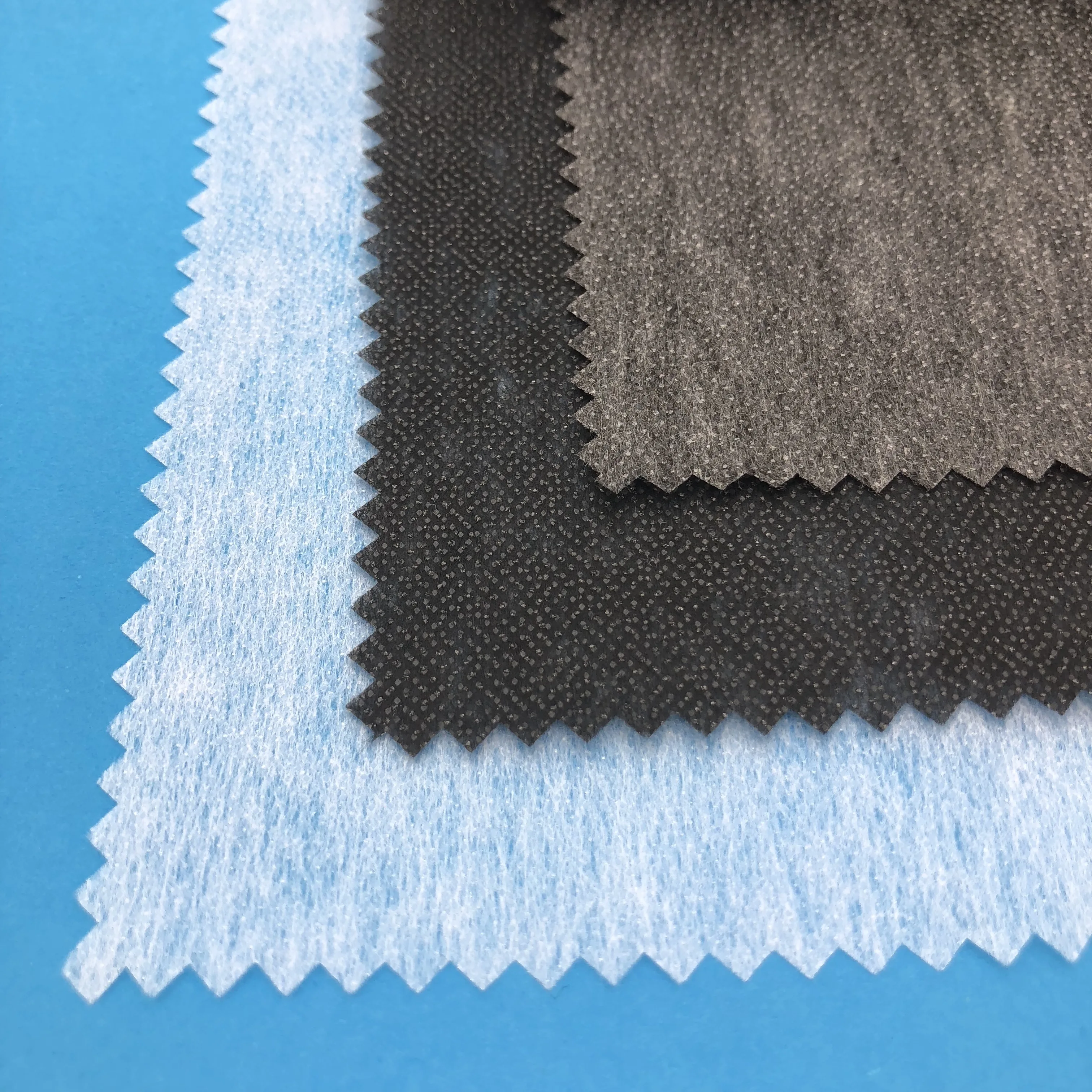 
100 polyester nonwoven fusible hot rolling interlining for apparel 