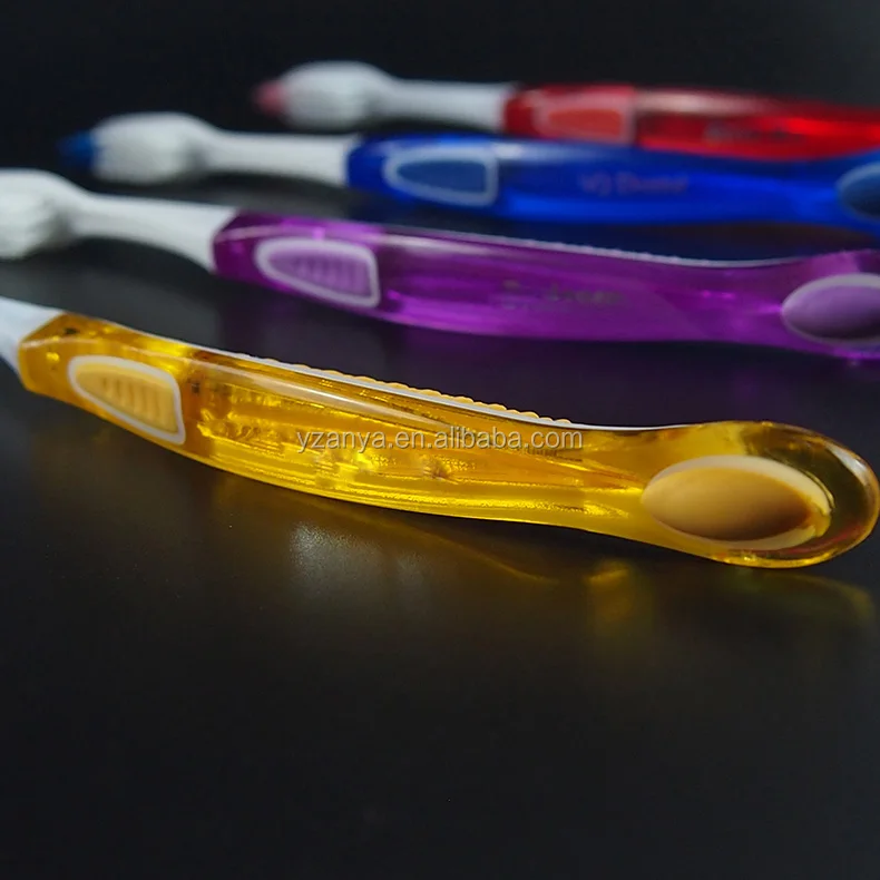 soft rubber handle adult toothbrush with tongue cleaner