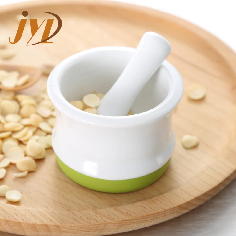 
China factory new design mini size herb spice small ceramic mortar and pestle with Silicone anti skid ring 
