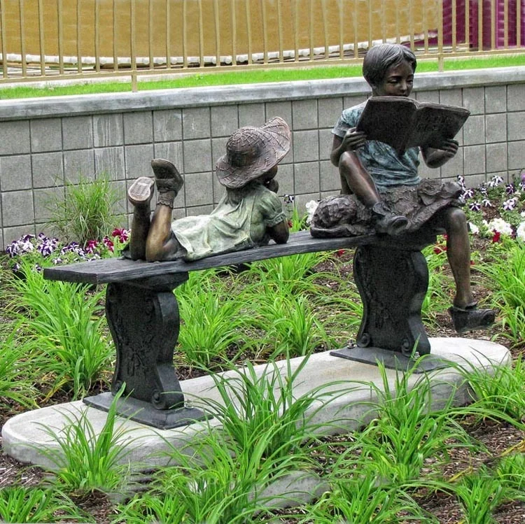 modern outdoor decoration bronze girl and boy reading on bench sculpture