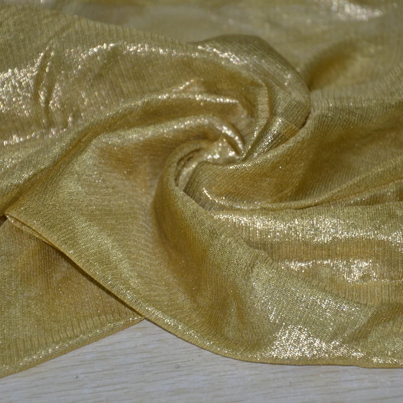 
silk gossamer golden shiny silk tulle fabric with foil 