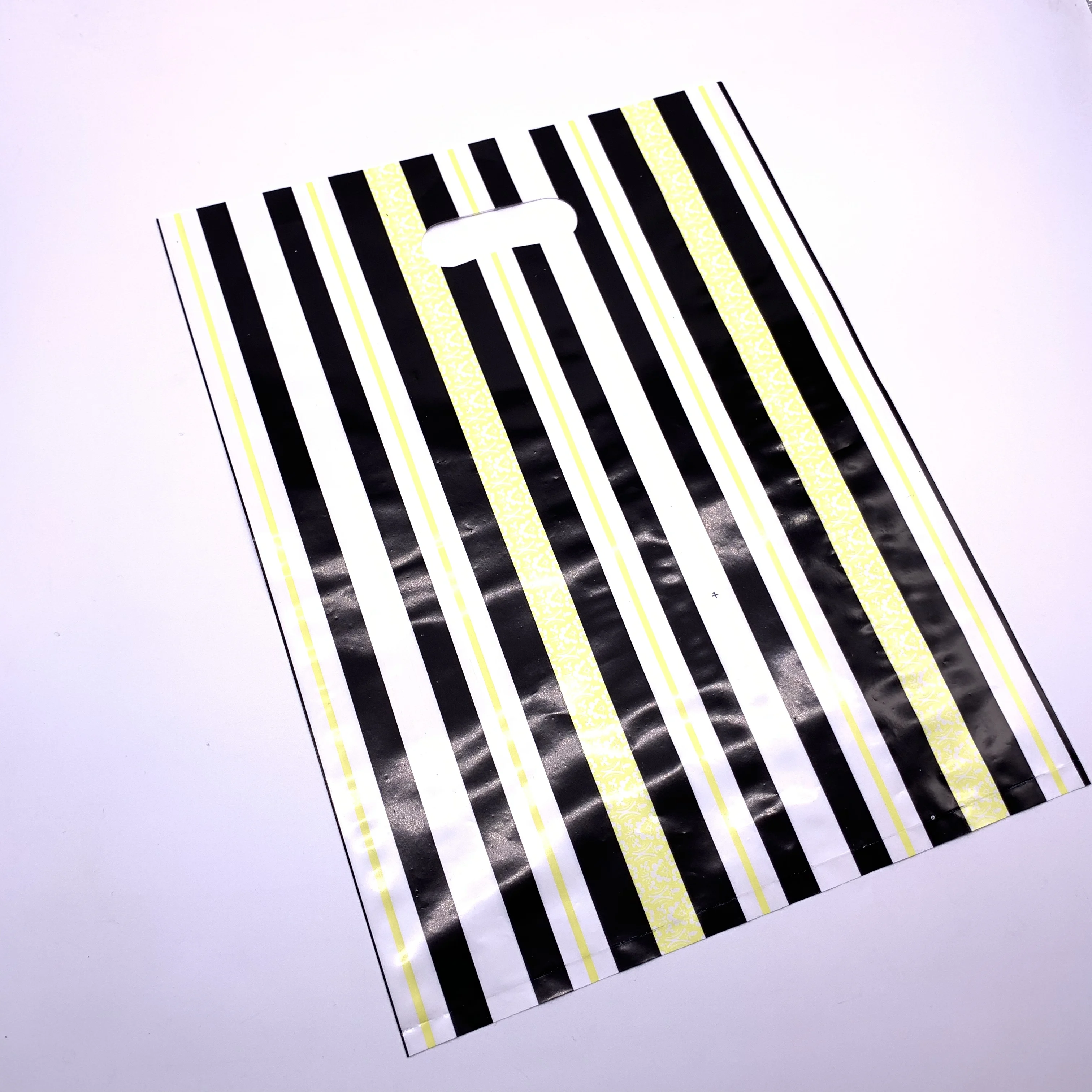 Custom made handle die cut plastic bags