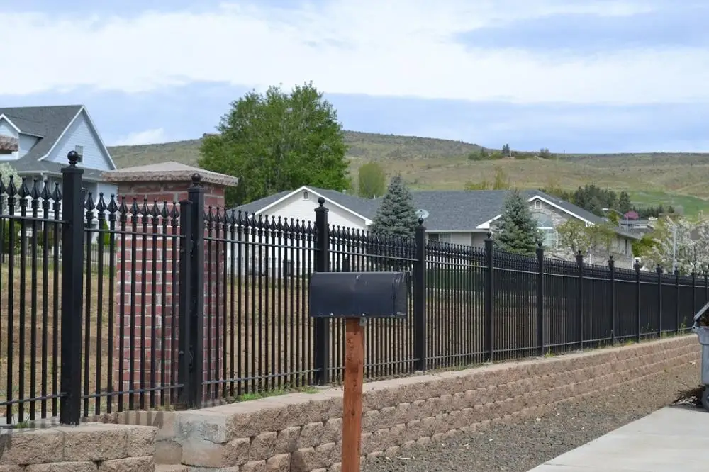 Wrought Iron Gate Mounted Between Stone Pillars Secure-Nett fence