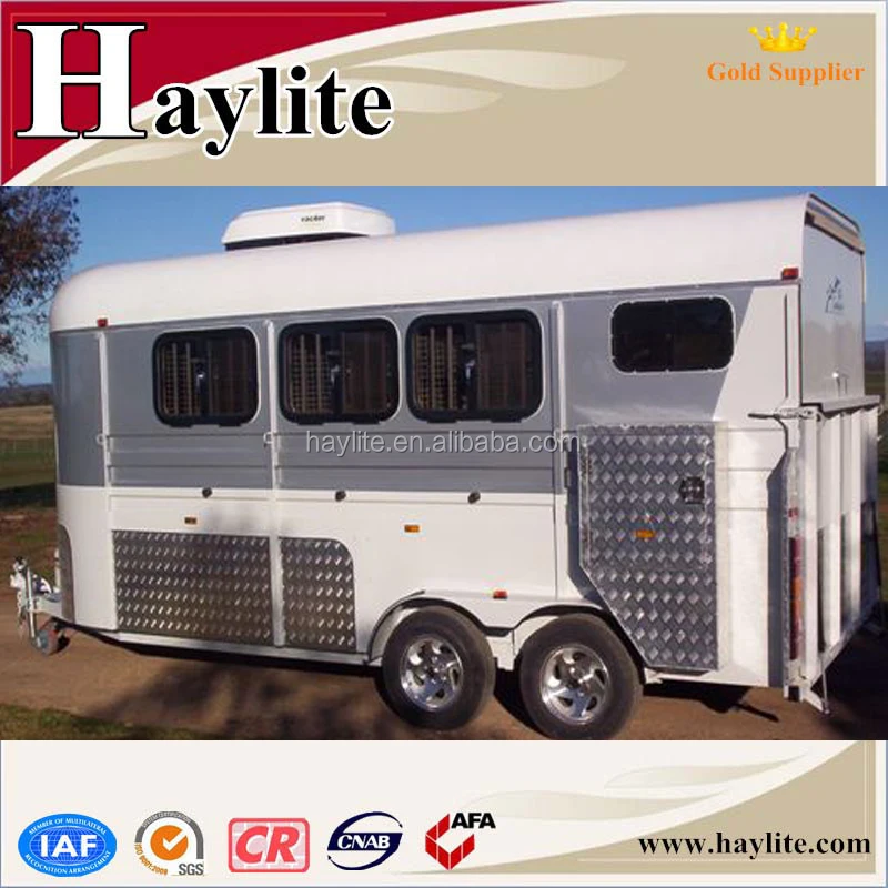 white gooseneck horse float with roof