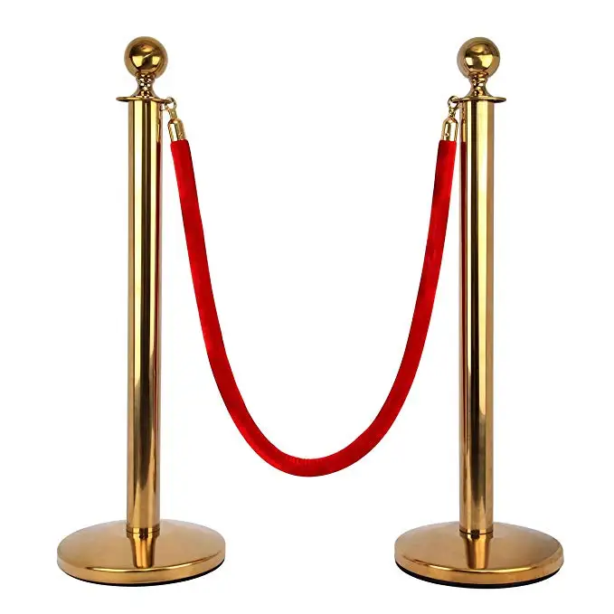 golden barrier stanchion set with red velvet rope