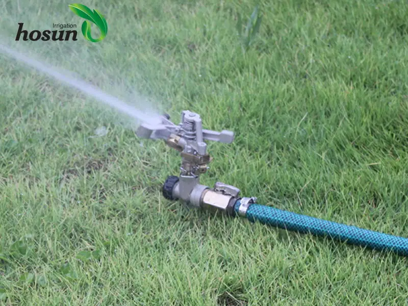 Brass impact sprinkler with zinc step spike