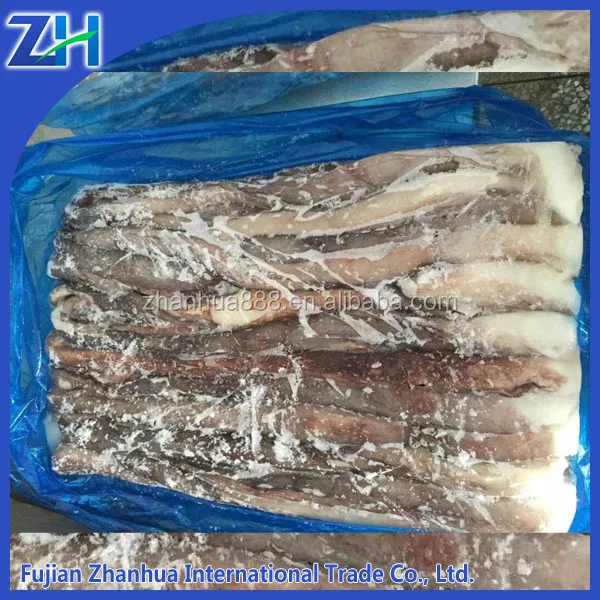 Сырое материал щупальца гигантского кальмара сексуального ноги