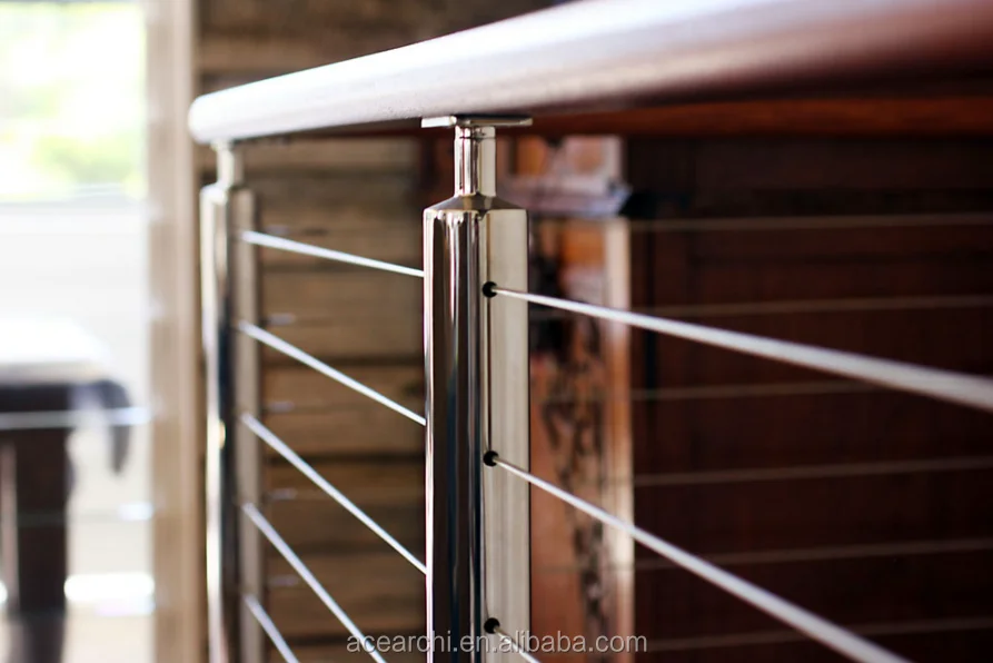 Vertical deck cable railing system with Round Stainless steel posts and Handrail