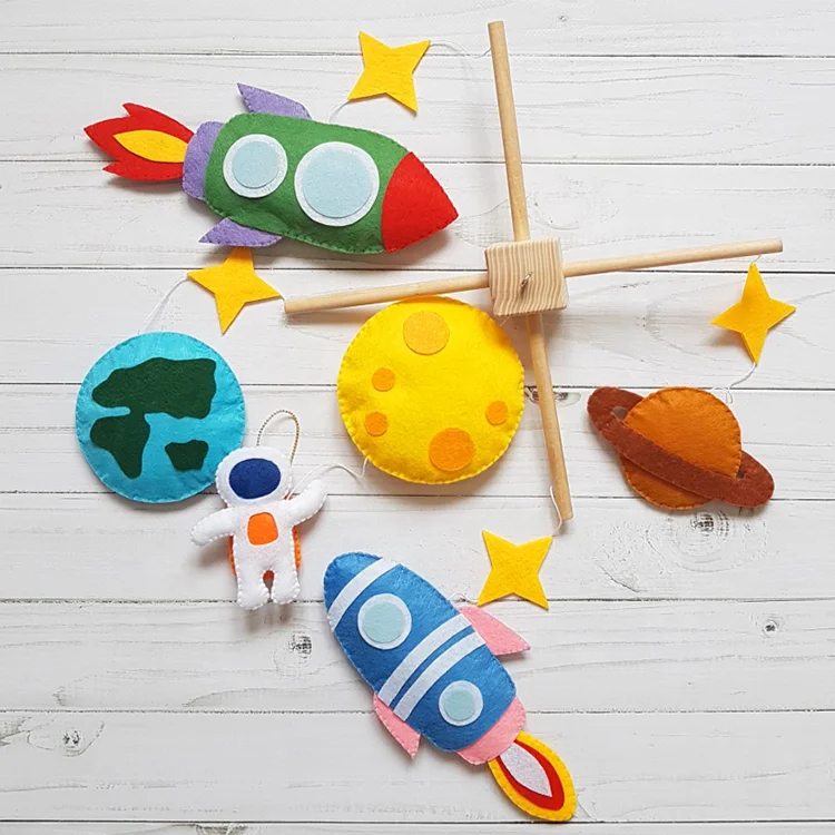DIY felt hanging crib decoration with rocket and spaceman shape