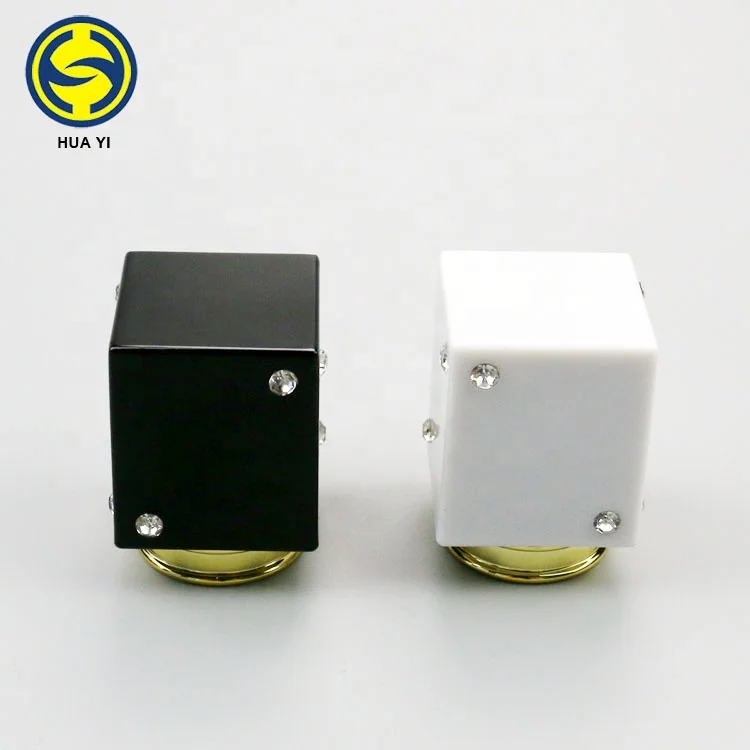 Black and white plastic cap for perfume bottle cover