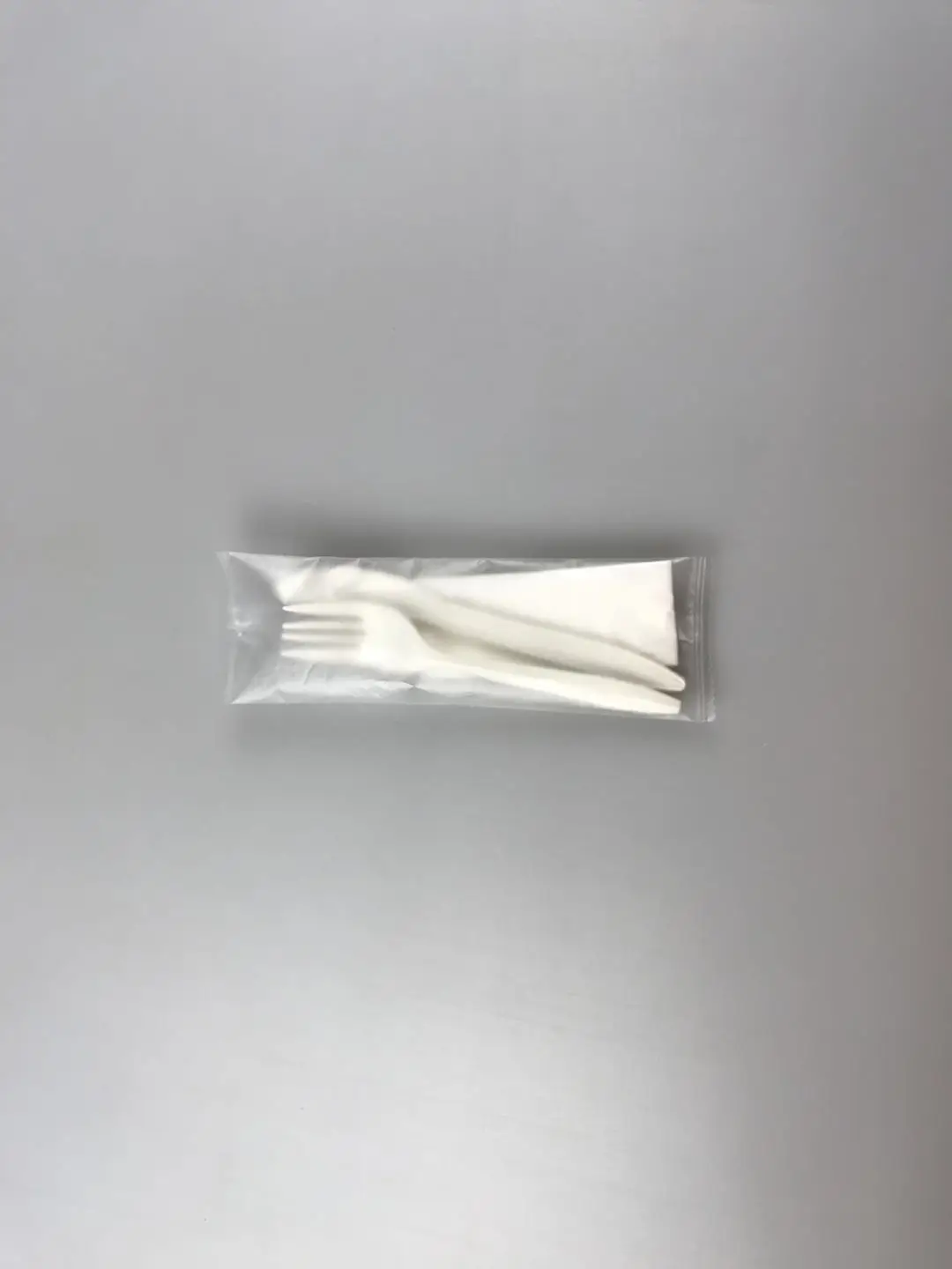 Spoon separately wrapped plastic wrapped spoon plastic spoon with napkins wrapped