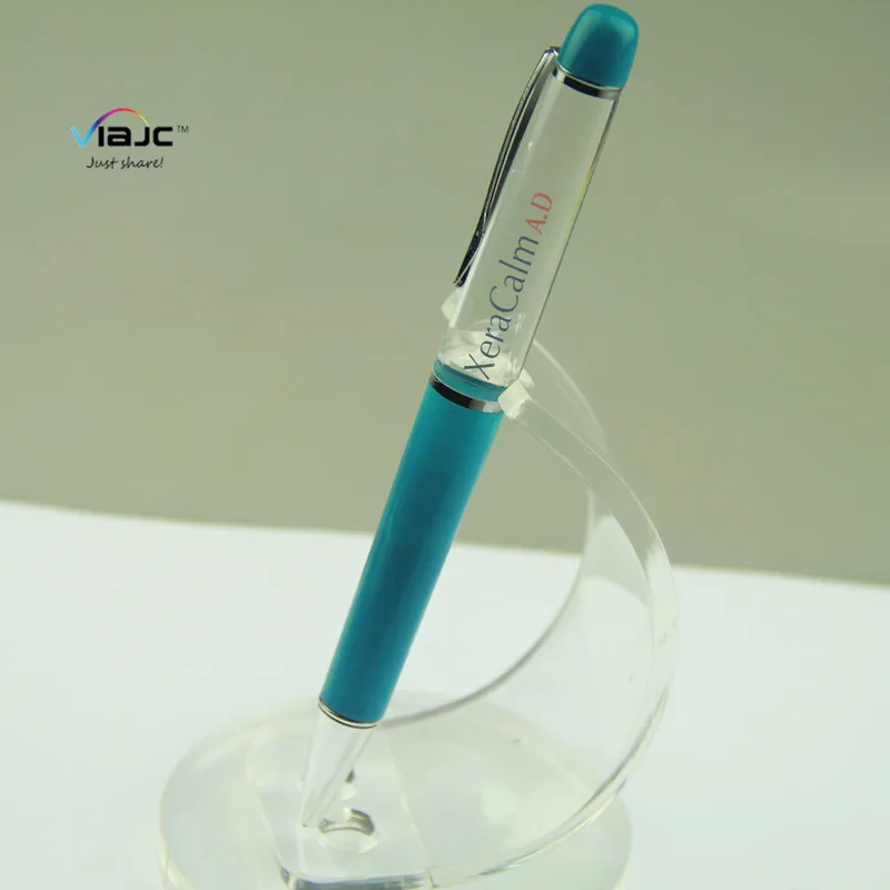 a sliding case showing a floatinc scene ink liquid floating promotional pen