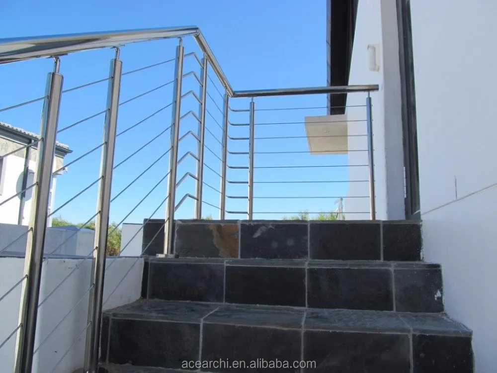 Vertical deck cable railing system with Round Stainless steel posts and Handrail