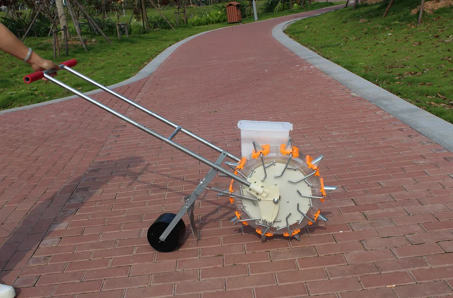 Hand-propelled household small roller seeder for planting corn, soybean, cotton and wheat