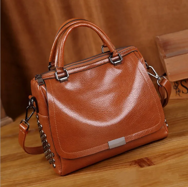 generation of handbags new European and American Boston pillow bag retro fashion handbag rivet Messenger shoulder bag