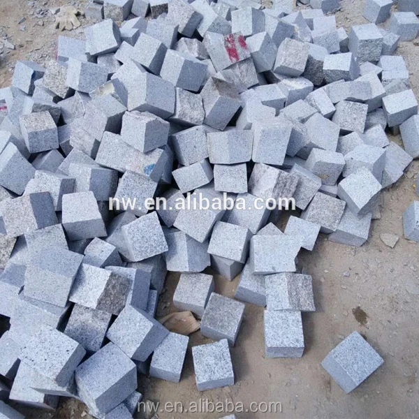 
grey granite small blocks, natural surface, paving stone 