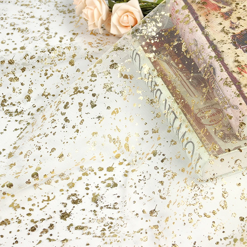 Wholesale polyester golden transparent spotted flash mesh fabric for clothing