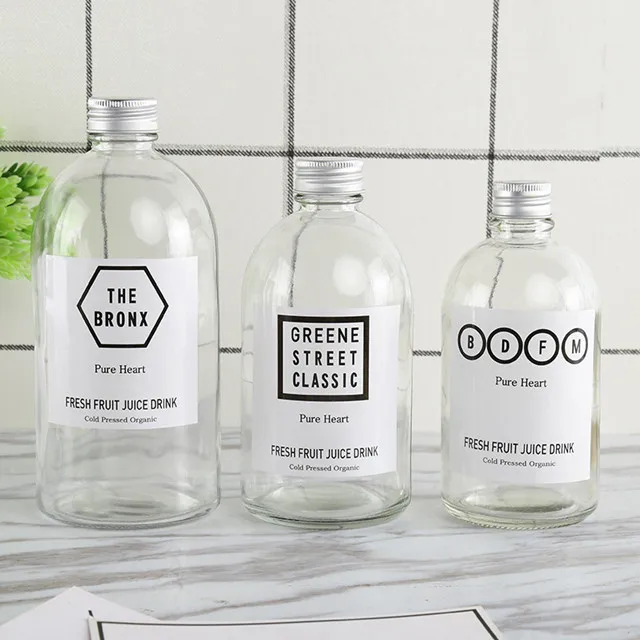 new design wholesale price available different sizes frosted and clear glass juice bottle