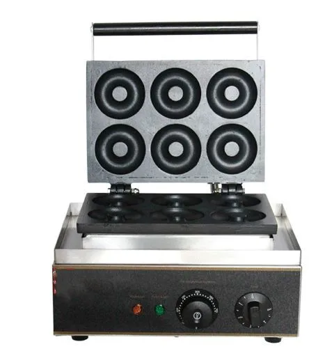 Best selling baked processing solid frying glazed berliner aerosol hole maker donut making machine for sale (62049761007)