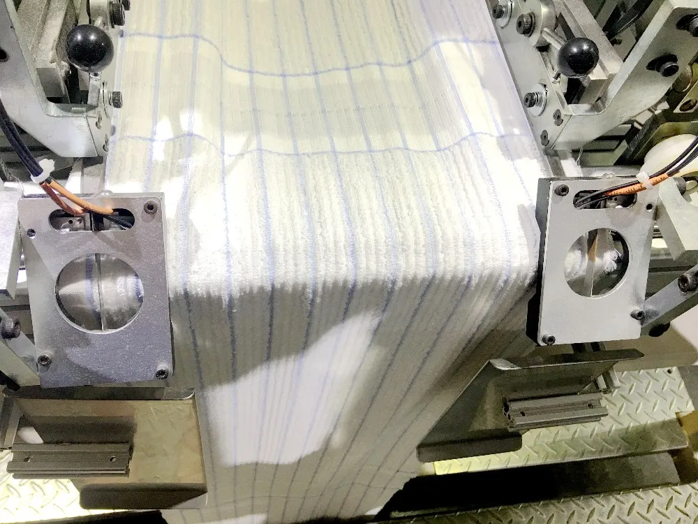 AUTOMATIC TERRY TOWEL LENGTH HEMMING MACHINE