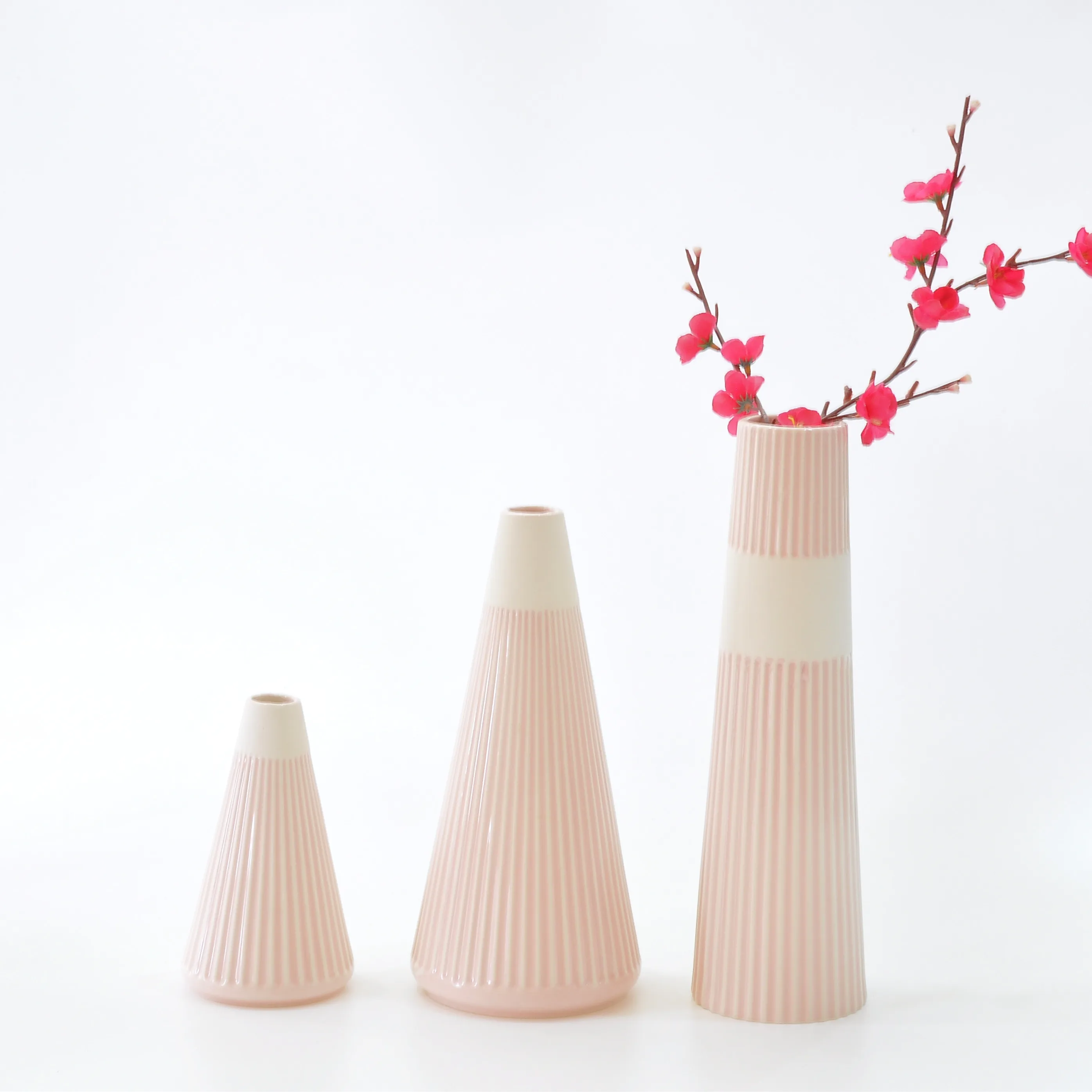 Modern decorative slim ceramic vases with flowers in glaze with rubbing