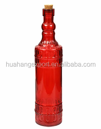 Colored patterned glass bottle with cork lid